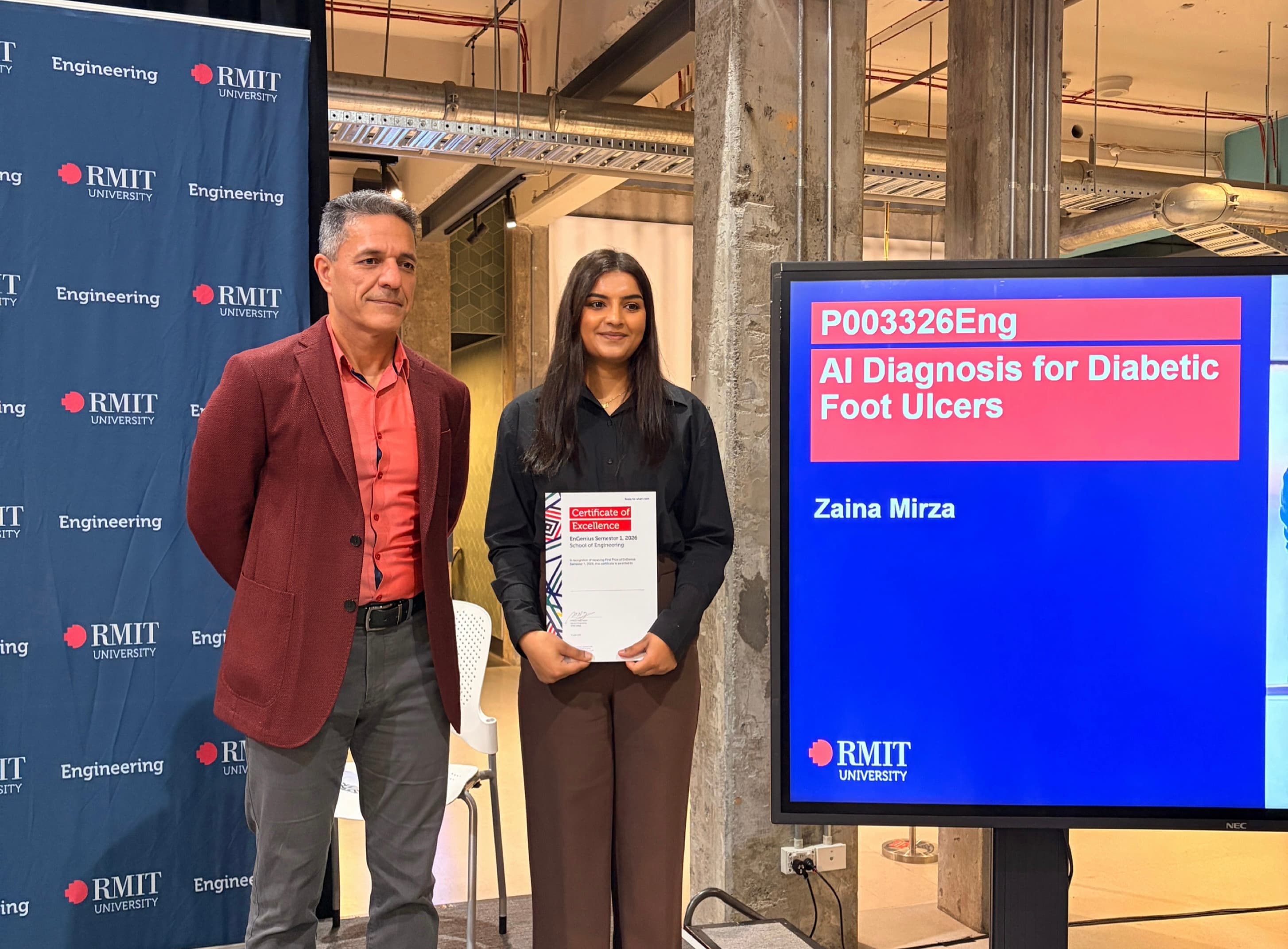 Zaina Mirza receiving the EnGenius Award